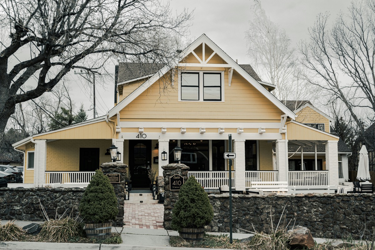 Craftsman porch with tapered columns and wide steps