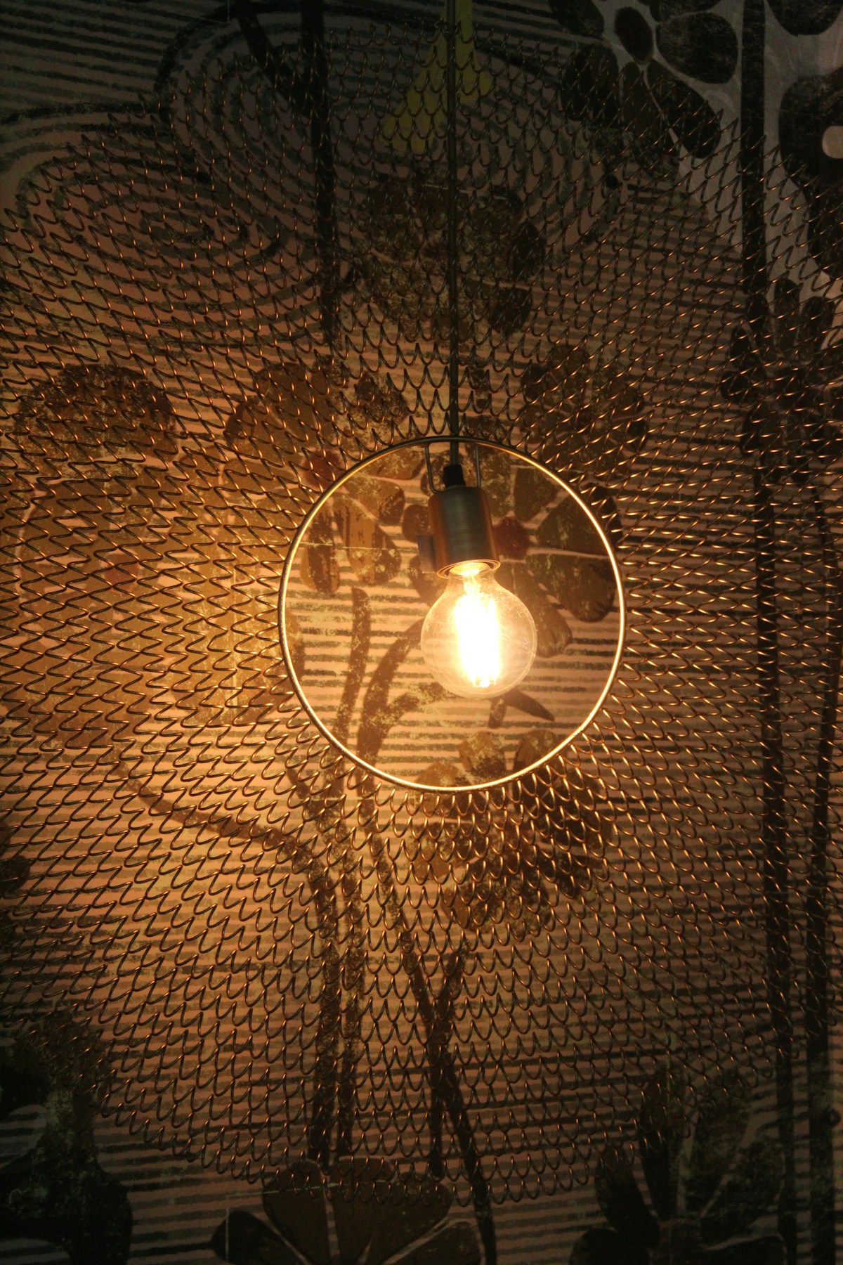Craftsman pendant light fixture with warm amber tones